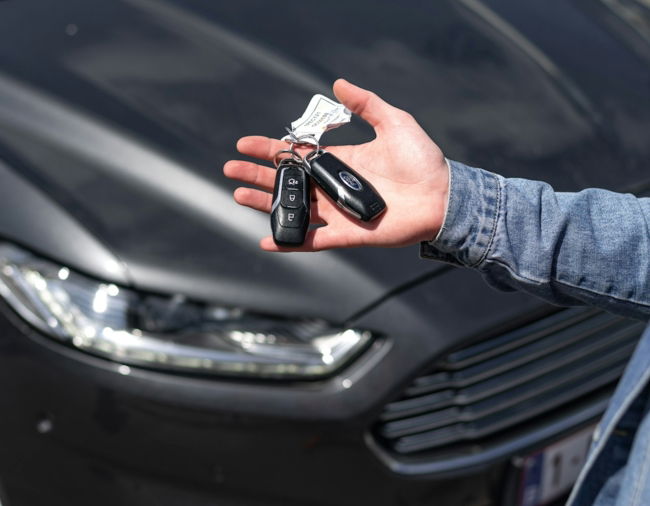 a hand holding a key